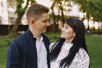 Beautiful couple spend time on a summer park