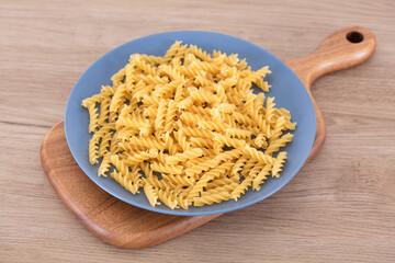 Whole wheat uncooked spaghetti on a plate