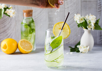 Detox water with cucumber, mint and lemon juice. Cucumber water.