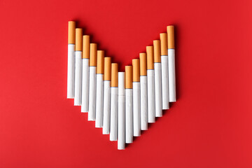 Many cigarettes on color background