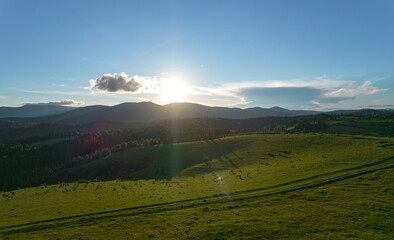 Mountain valley during sunrise. Natural summer landscape. A sunny morning in the mountains. Beautiful landscape composition