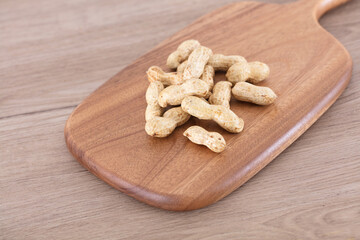 Peanuts on cutting board
