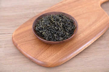 A plate of Rizhao green tea on a cutting board