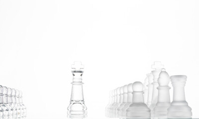 king chess pieces on a glass chessboard 