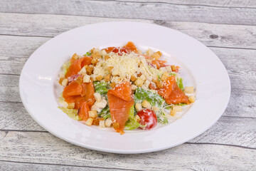 Caesar salad with salmon and parmesan