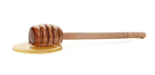 Wooden dipper and spilled honey on white background