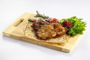 Grilled pork loin served onion