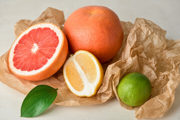 Healthy citrus fruits on light background