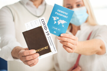 Tourists with International Certificates of Vaccination and immune passports at the airport