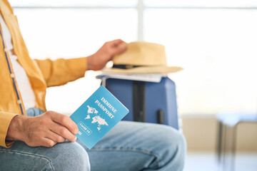 Male tourist with immune passport at the airport