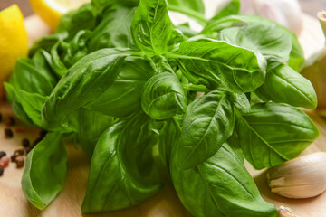 Fresh basil leaves on table, closeup