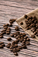 Roasted coffee beans on old wooden table