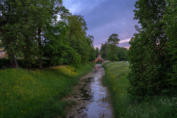 Cross bridge in the Alexander Park of Tsarskoye Selo on a cloudy summer evening, Pushkin, St....