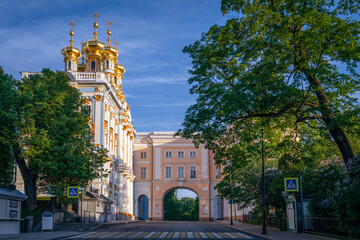 View of the Church of the Ascension of Christ-the palace church of the Catherine Palace and the arch of the Pushkin Memorial Museum-Lyceum in Tsarskoye Selo on a sunny summer day. Pushkin, St. Petersb