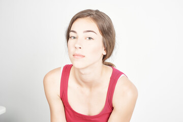 Fototapeta premium pretty brunette in red t shirt close-up isolated background