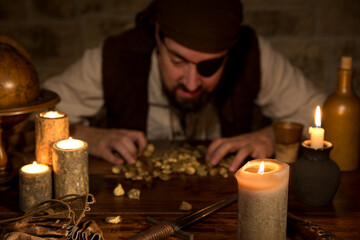 pirate counting his gold loot, medieval table with lots of candles and accessoires