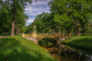 View of the Small Chinese Bridge in the Alexander Park of Tsarskoye Selo on a sunny summer evening,...