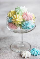 Small colorful meringues in the glass