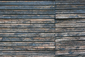 material texture of wooden planks with blue peeling paint