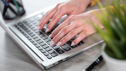 Female hands working on laptop