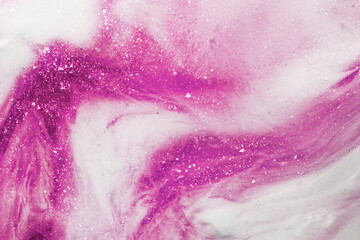 Liquid art gel pink gradient background with glitter. Slime toy. Abstract magenta and white surface. 