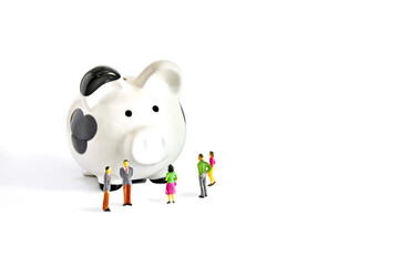 miniature people model with piggy bank  isolate on white , people saving concept