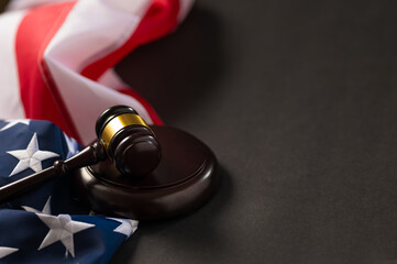 American State Flag and Judge's Gavel. Dark gray background. There is an empty space for your...
