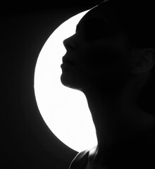 black and white portrait. Girl in dark. Female silhouette