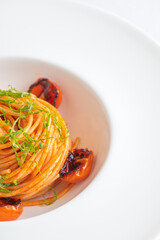 Spaghetti with tomato sauce and charred tomatoes