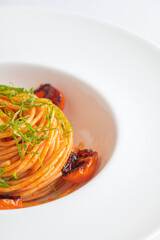Spaghetti with tomato sauce and charred tomatoes