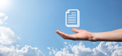 Male hand holding a document icon on blue background. Document Management Data System Business...