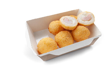 Rice croquettes with cottage cheese and shrimp in bread crumbs. Deep-fried. Delivery box. Close-up. White background. Isolated.