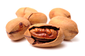 Peeled pecan nuts closeup, isolated on white background