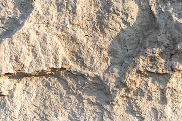 texture loose yellow stone in the setting sun