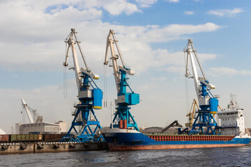 Fototapeta premium hree tugboats in a river port