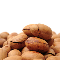 Peeled pecan nuts closeup, isolated on white background