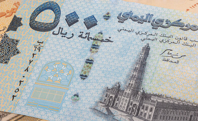 Close up to Rial, banknotes of the republic of Yemen. Detailed capture of the front art design of Rials. Detailed money background wallpaper. Currency banknotes of the Arabic country. 500 Rial Yemen