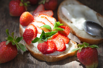 Bruschetta with strawberries on the table