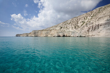 View from the sea of the tip of Tsigrado on the southern coast of the Greek island of Milos in the Cyclades