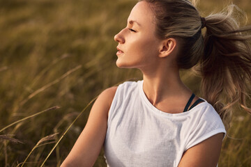 Young woman resting in summer field