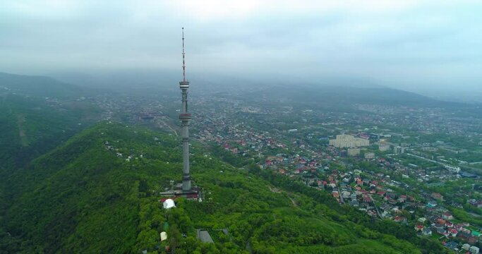 Aerial Panning Shot Of Television Tower On Mountain, Drone Flying Over Landscape - Almaty, Kazakhstan