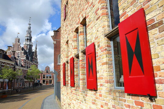 The Stadhuis (Town Hall) of Franeker, Friesland, Netherlands, located on Raadhuisplein street, with a medieval building in the foreground