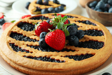 Concept of delicious dessert with blueberry pie, close up