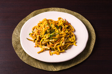 Asian vegetarian food udon noodles on plate on the table. horizontal