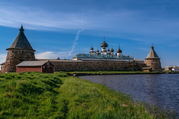 Fototapeta na wymiar View of the Solovetsky Monastery from the side of the Holy Lake on a sunny cloudless morning, Solovetsky Island, Arkhangelsk region, Russia