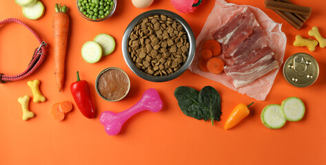 Concept of organic pet food on orange background