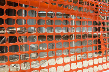 Obraz premium plastic safety net for the protection of the construction site during the renovation of a building with materials for energy saving