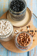 Variety of legumes in glass jars. Healthy eating ingredients, natural protein food