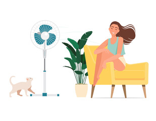 A girl gets blown by a fan on a hot day