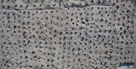 Concrete wall with decorative stones background. Concrete texture background. Granite stones pattern.